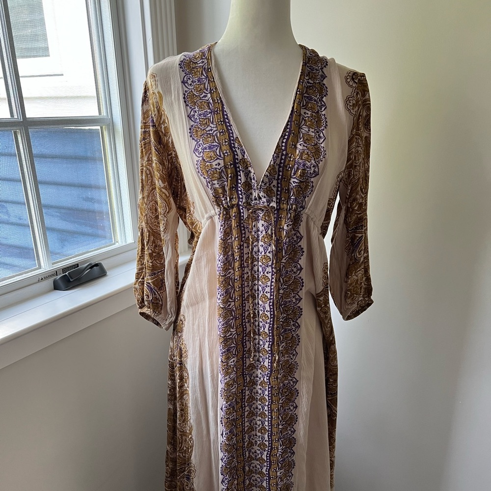 Free People festival dress with cinch waist detail and balloon sleeve.